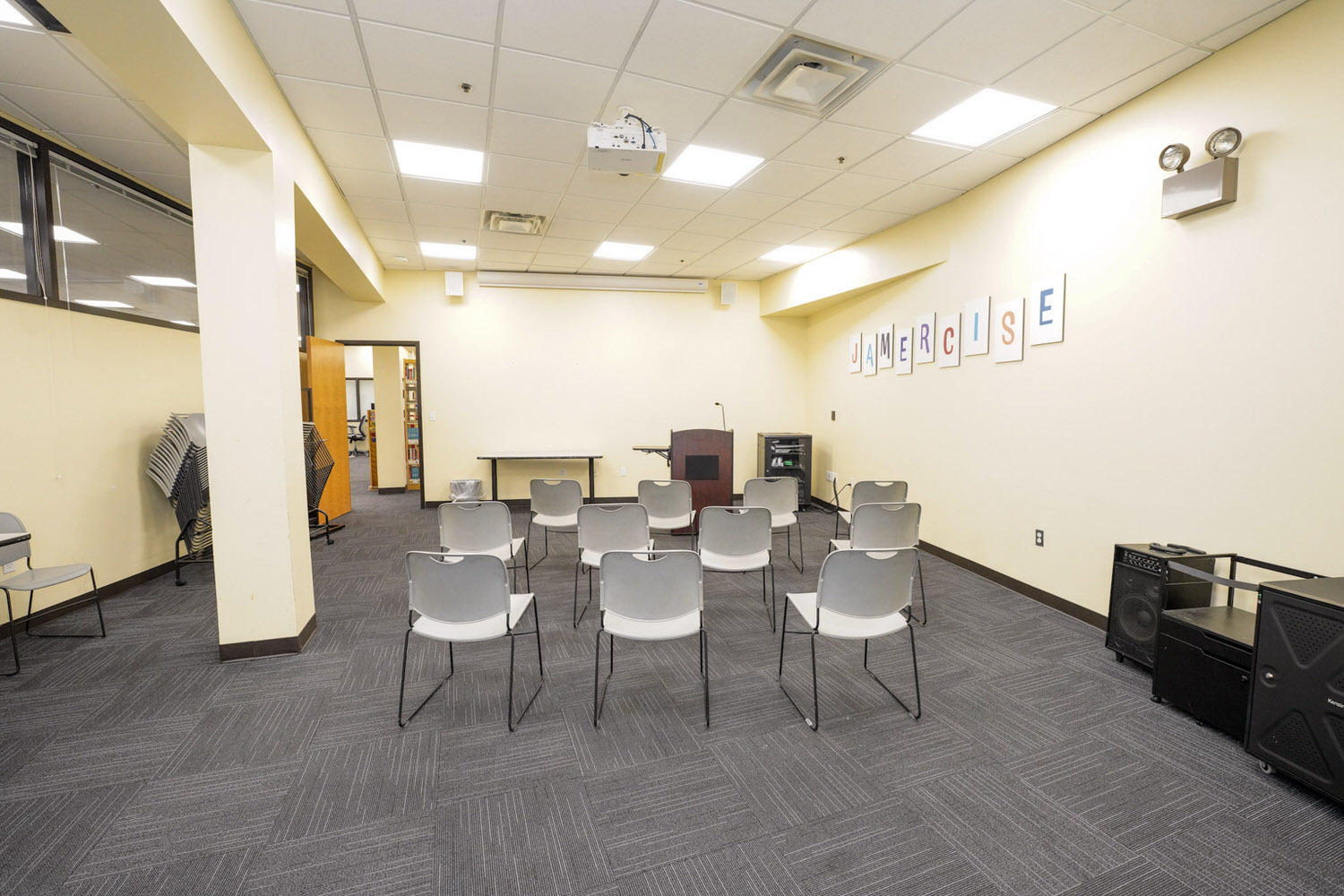 Cherry Hill meeting room showing  chairs facing a podium with microphone