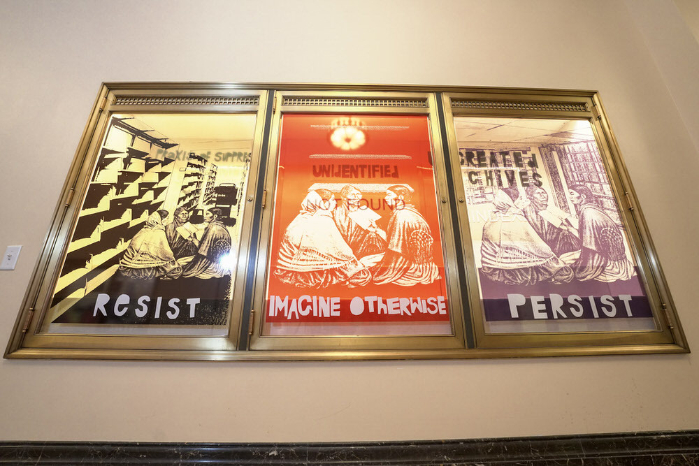 Hoesy Corona display at Pratt Library with words Resist, Imagine Otherwise, Persist