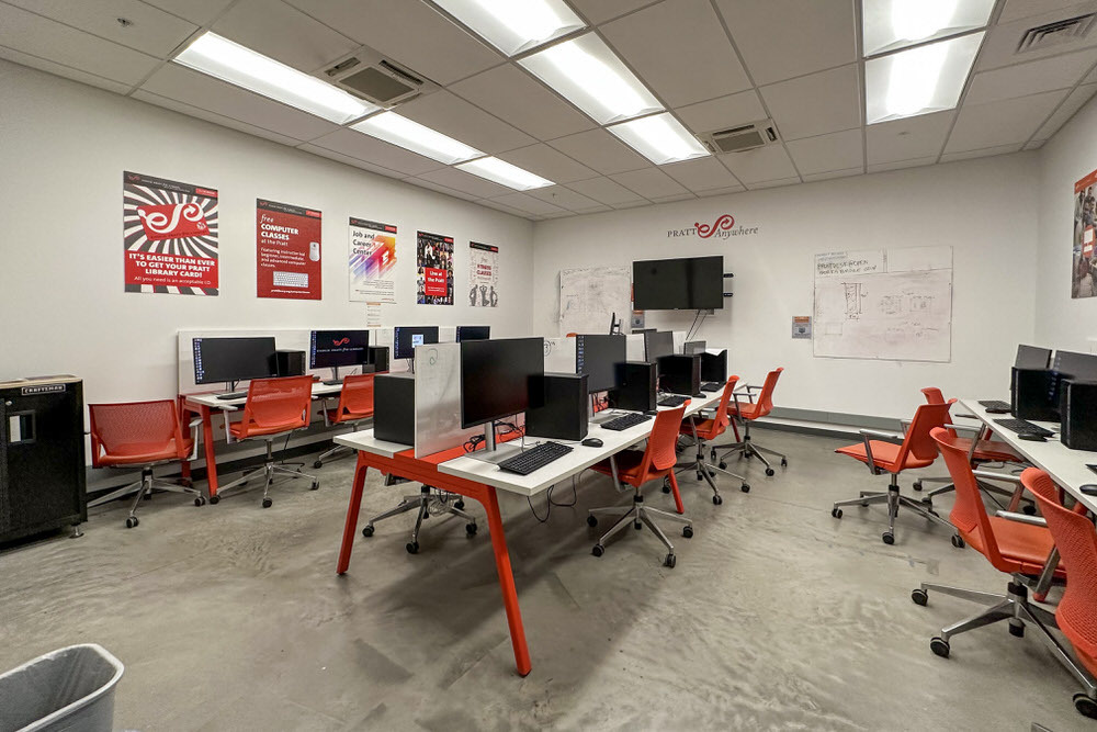 Open Works Technology Lab - Pratt Anywhere computers, tables, chairs, posters