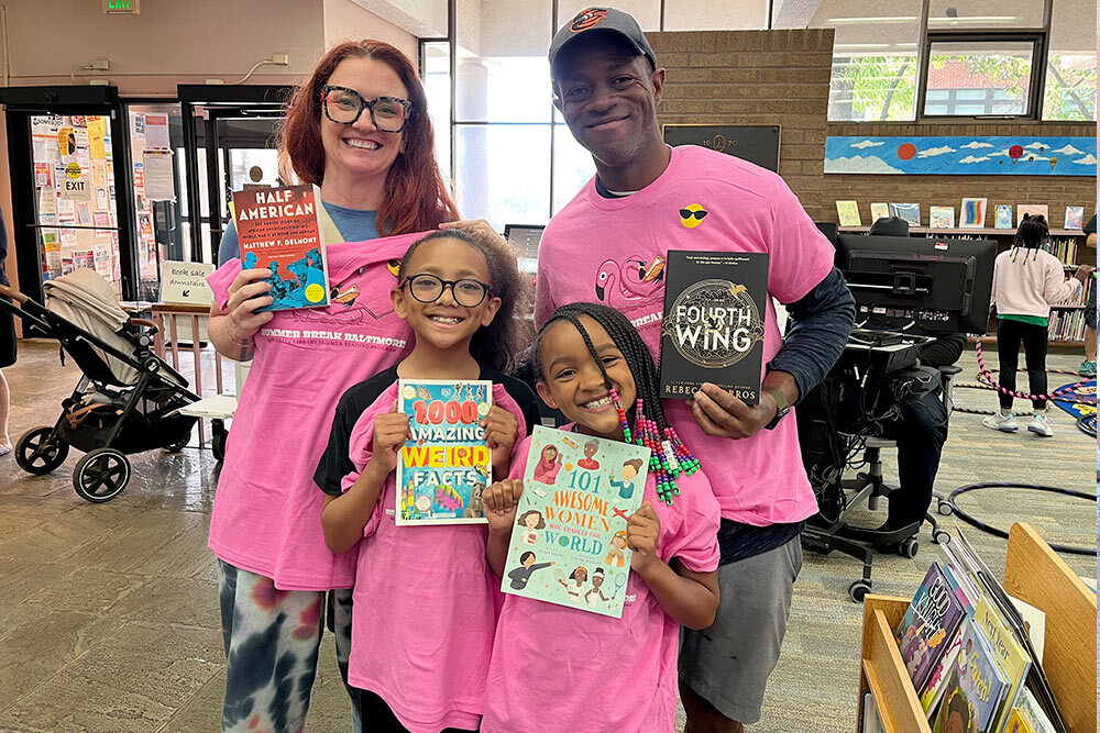 Summer Break Baltimore - a family of four with their 2025 books and t-shirts